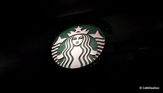 Starbucks siren made of wood at University Village Starbucks, August 2014