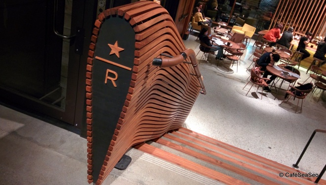 Starbucks Reserve Roastery & Tasting Room - Decorative wood bannister featuring the Starbucks Reserve R and star